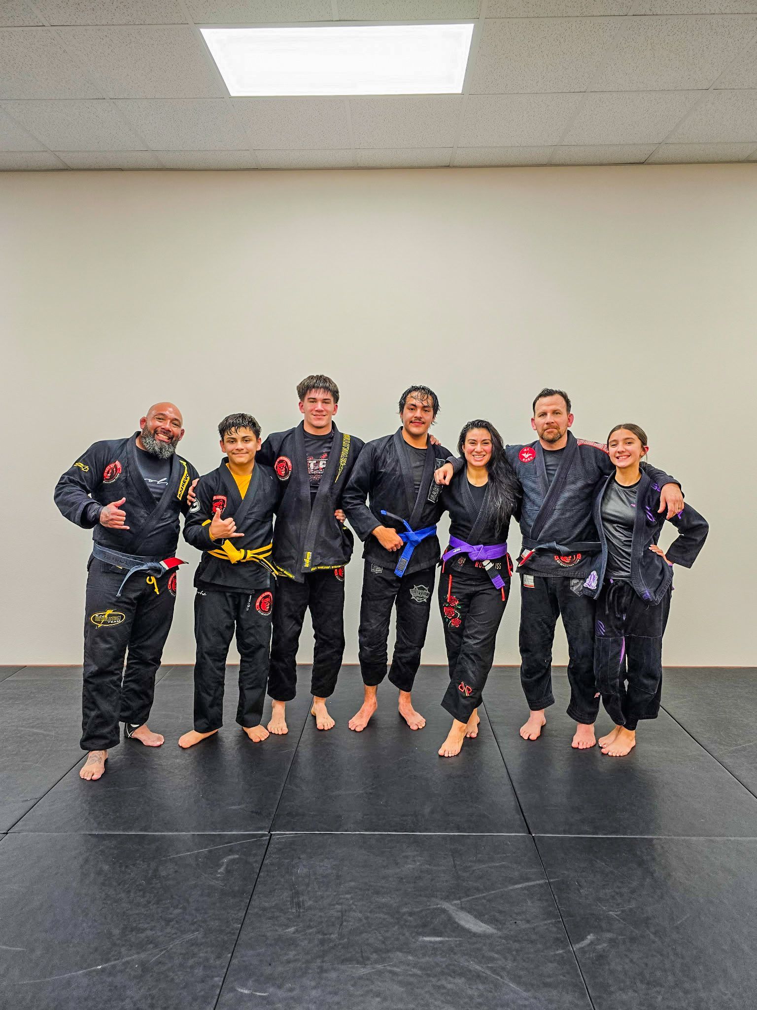 Adults drilling Brazilian Jiu-Jitsu techniques at Sugoi Submission in Corpus Christi, Texas to build focus and strength