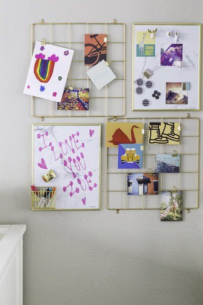 A wall with a bunch of pictures and drawings on it