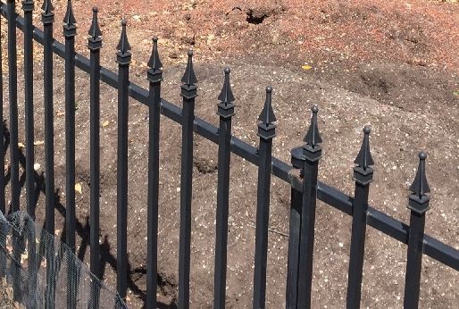 A Close Up of a Black Wrought Iron Fence on a Dirt Road. | Vallejo, CA | Tri-City Fence Company