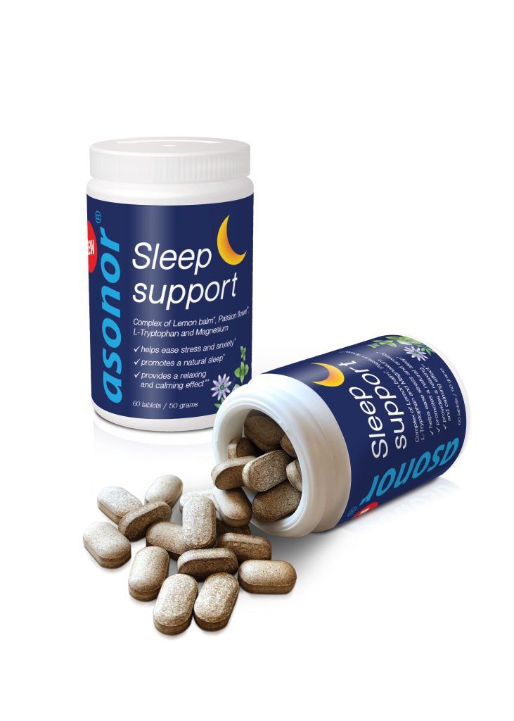 Blue-and-white sleep support supplement bottles with capsules spilling out