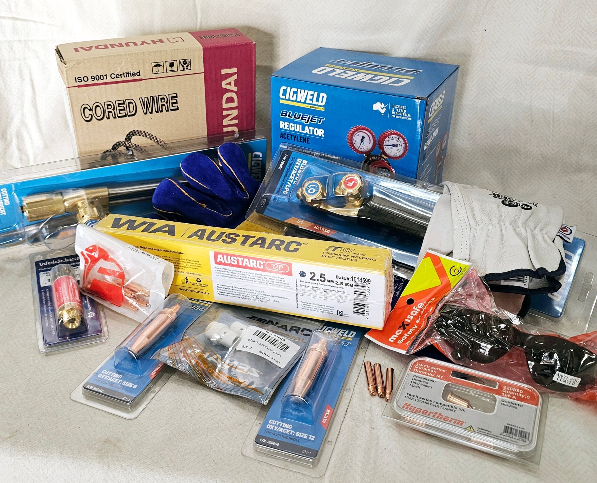 A bunch of welding tools are sitting on a table