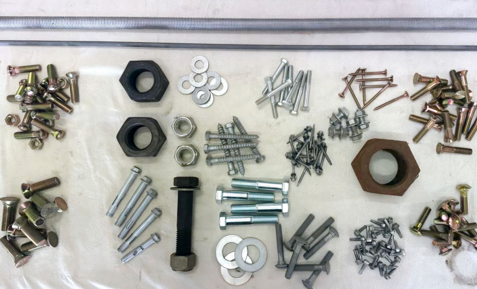 A plastic bag filled with nuts bolts and washers