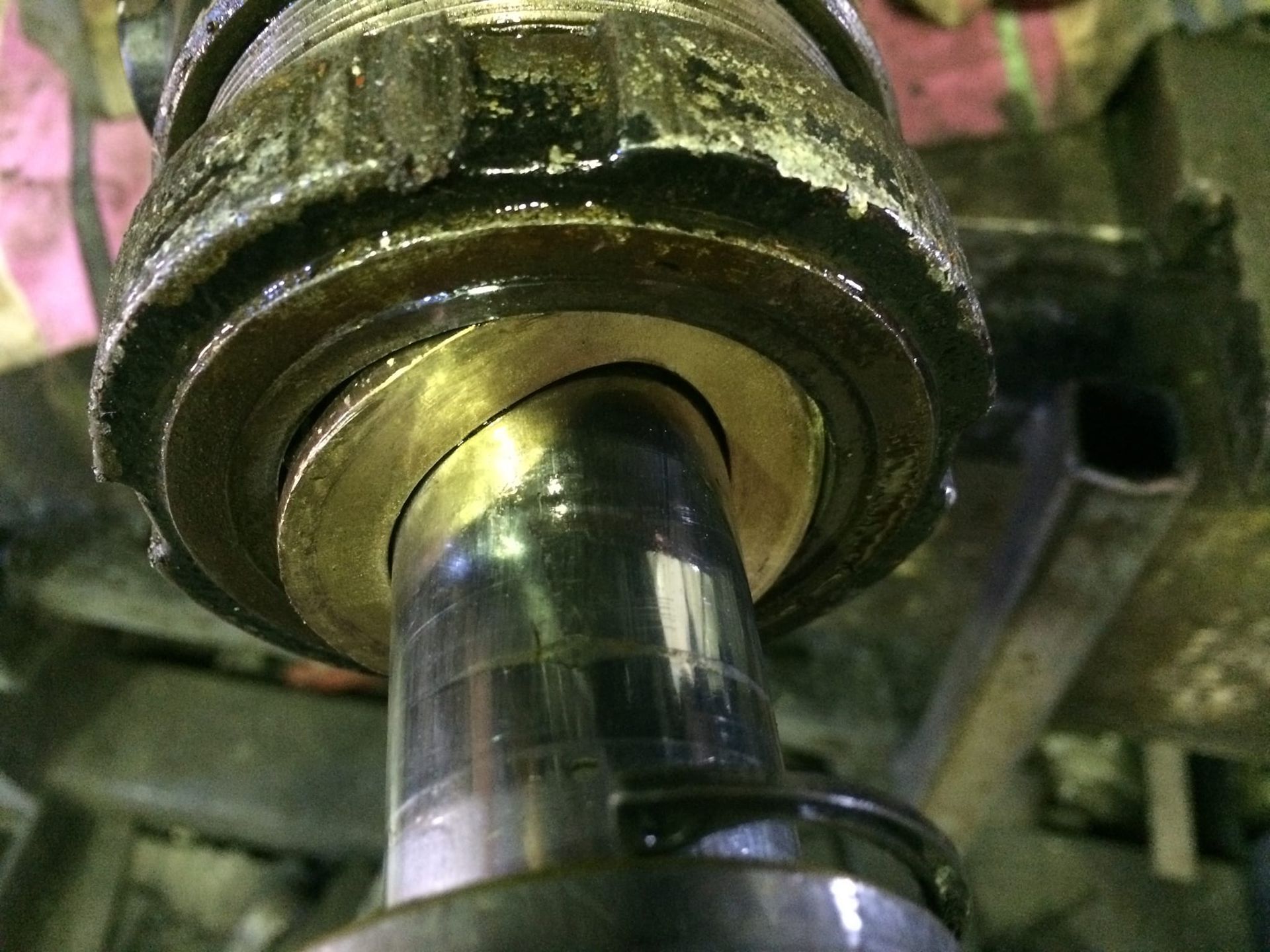 A close up of a metal object with a bearing on it.
