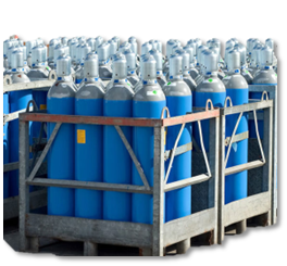 A bunch of blue gas cylinders are stacked on top of each other