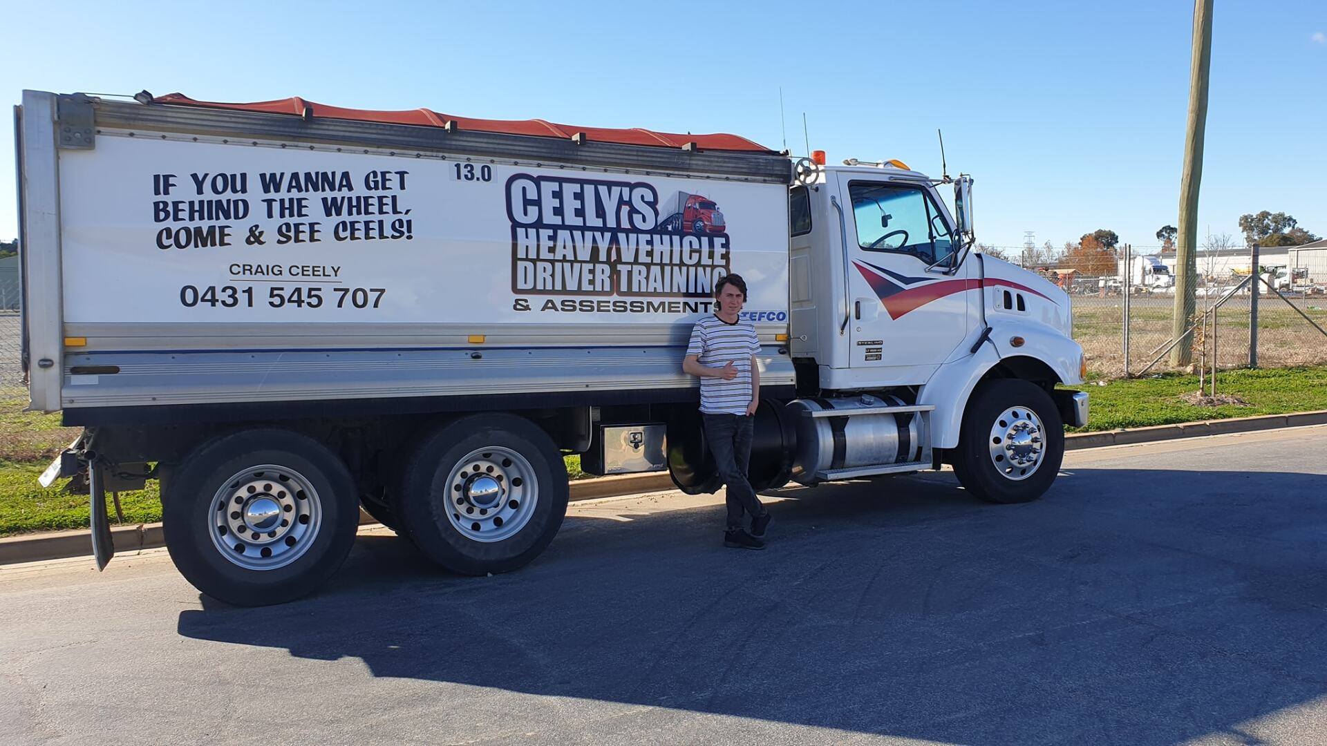 Happy Man With Truck After Passing Licence — Ceely's Heavy Vehicle Driver Training & Assessments In Yass, NSW