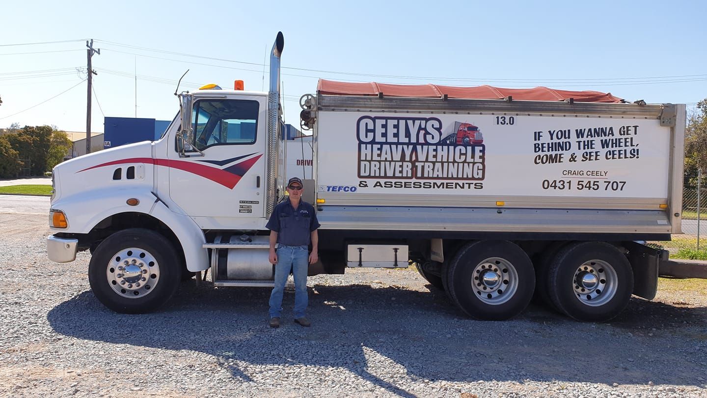 Man With a Hat and Sunglasses Posing With His Truck — Ceely's Heavy Vehicle Driver Training & Assessments In Griffith, NSW