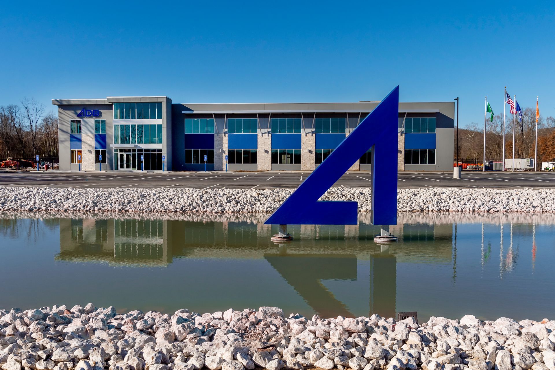 A large building with a blue triangle in front of it