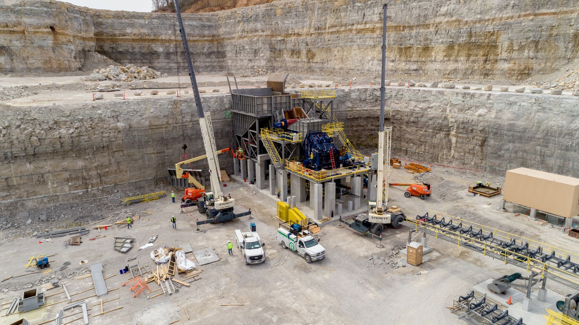 An aerial view of a construction site in a quarry.