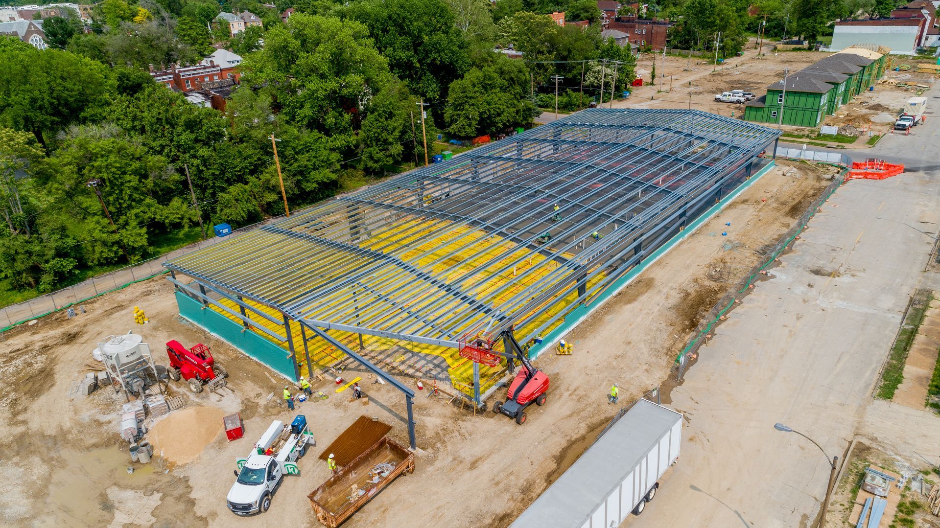 An aerial view of a large building under construction.