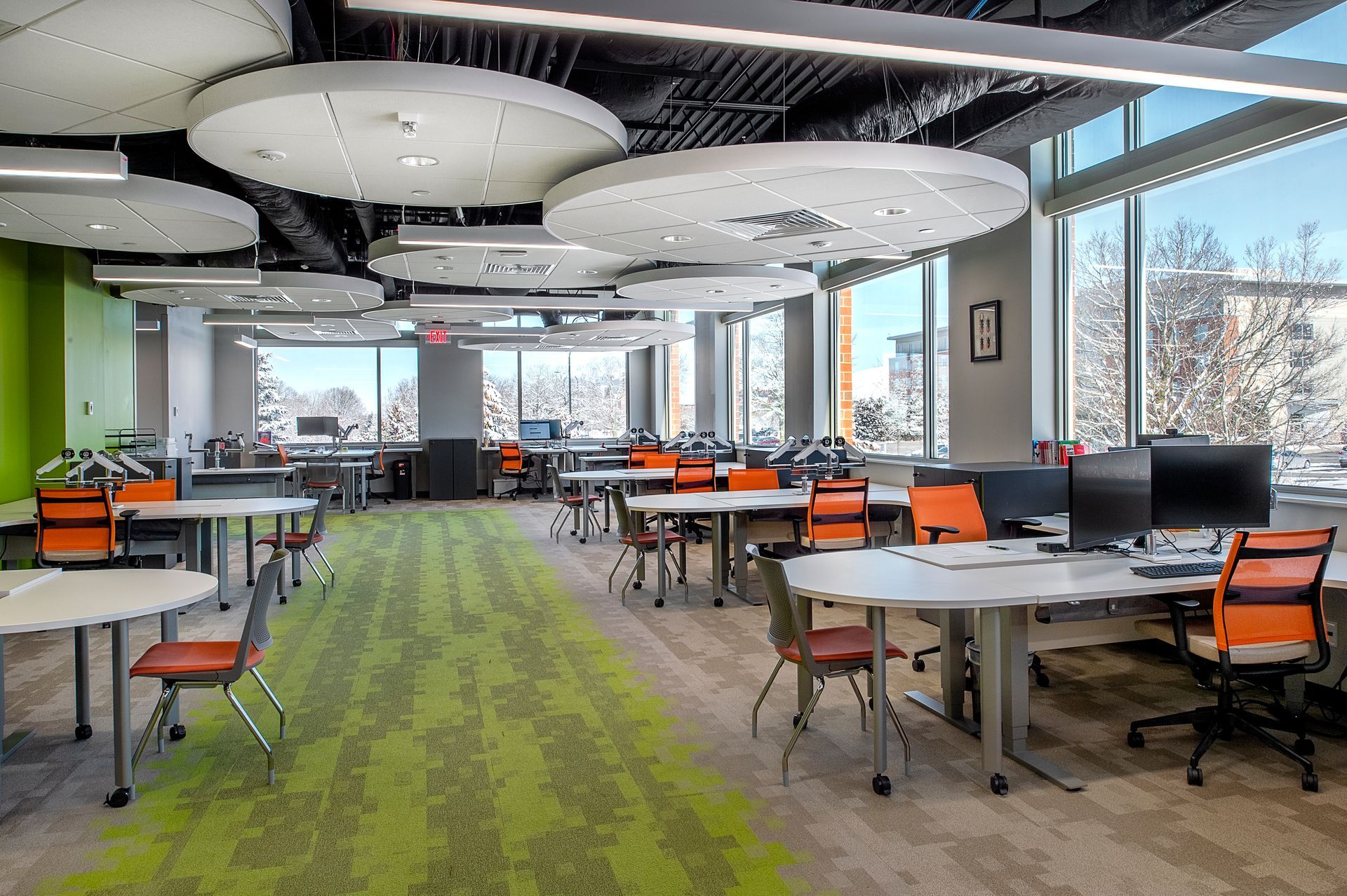 A large room with tables and chairs in it