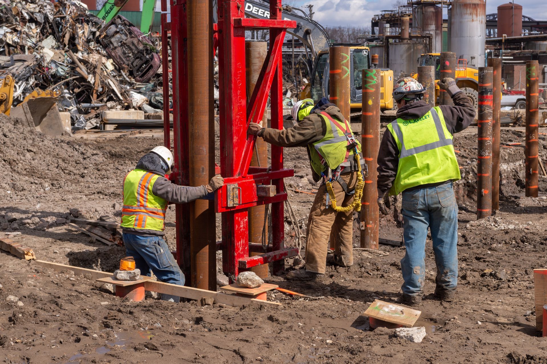 A group of construction workers are working on a construction site.