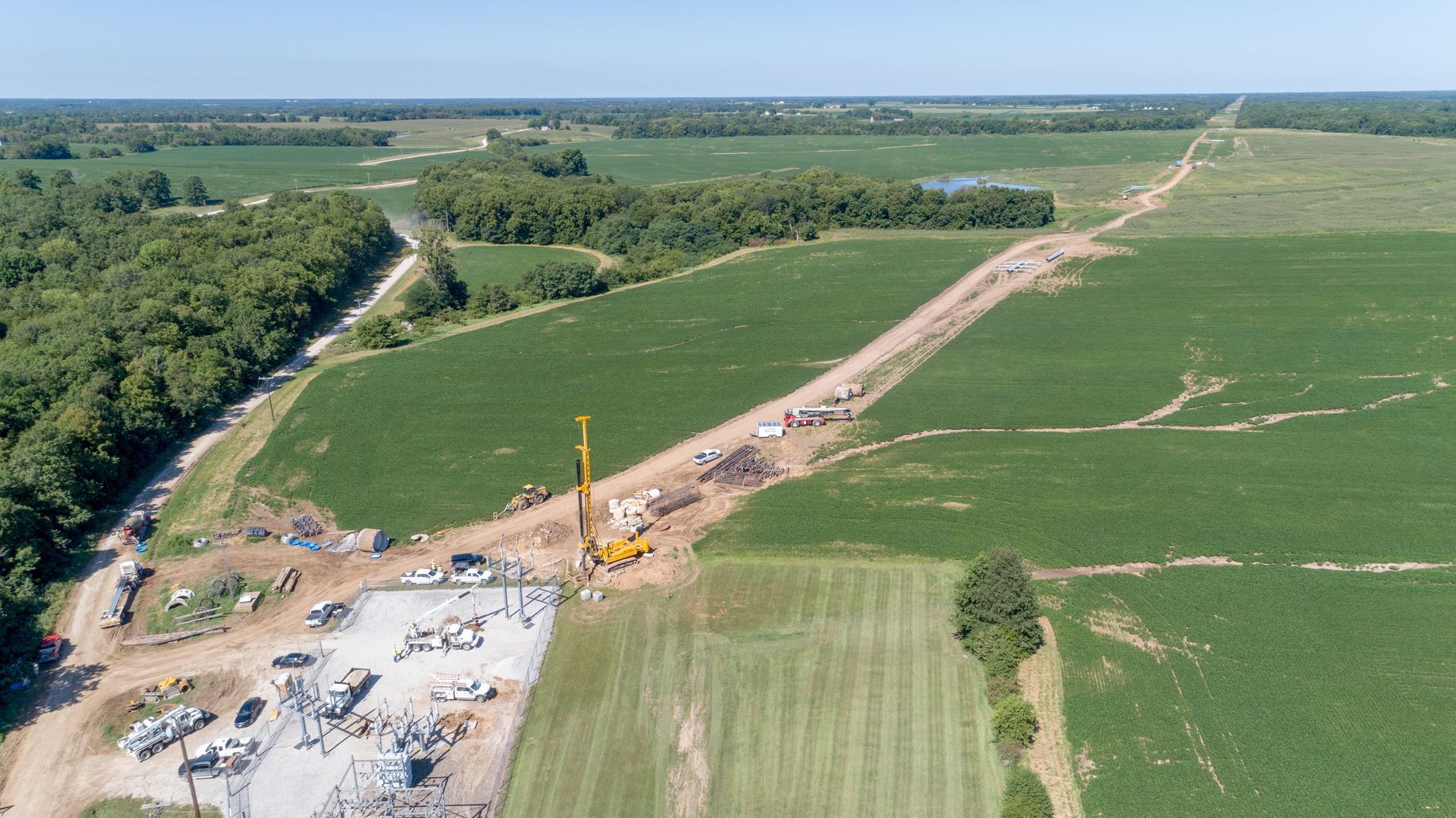 An aerial view of a construction site in the middle of a field.