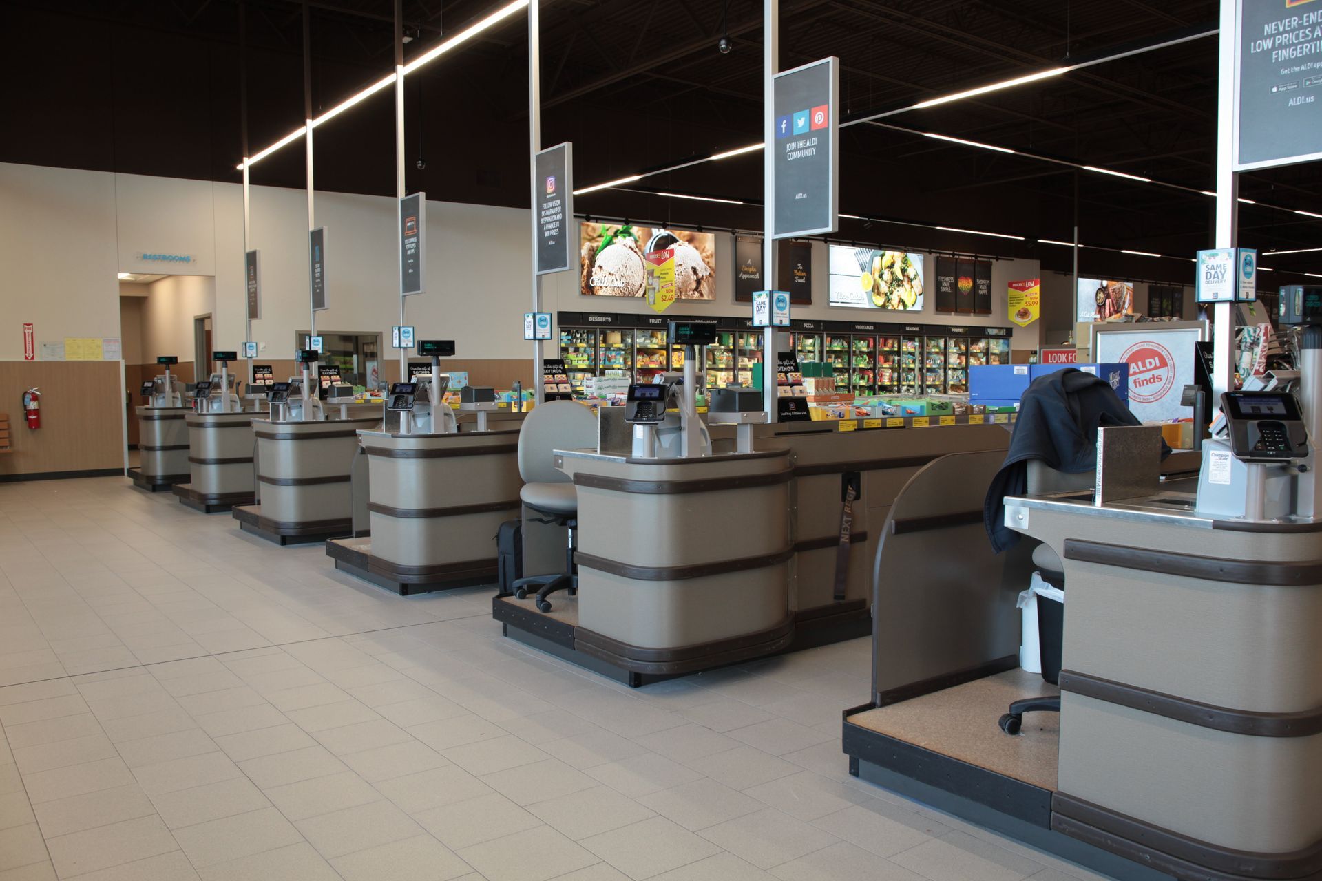 A row of cash registers in a grocery store.