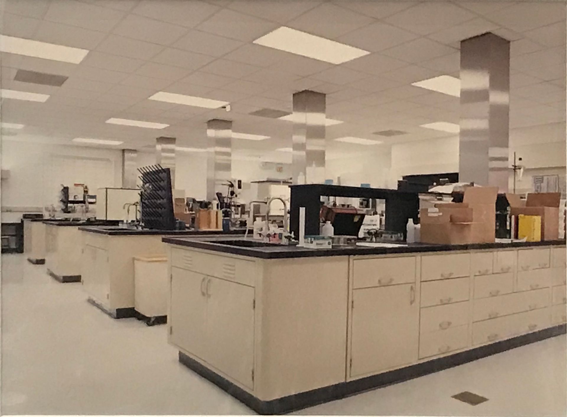 A large room with a lot of cabinets and counters