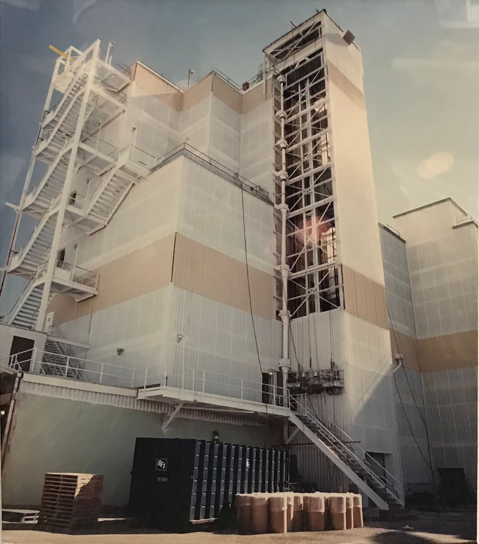 A large white building with stairs leading up to it