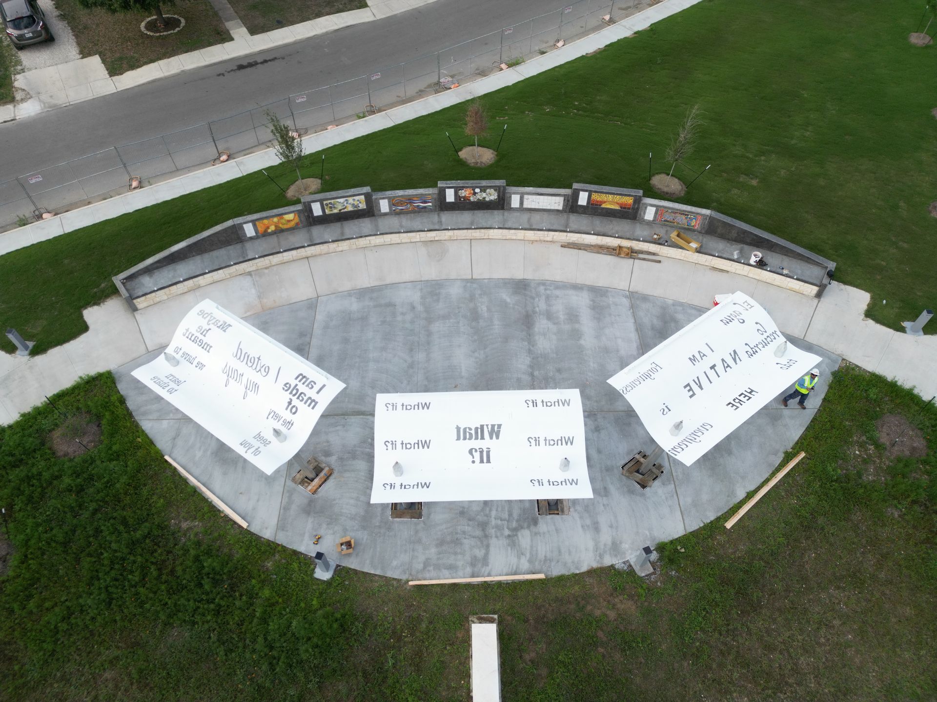 An aerial view of a concrete amphitheater under construction