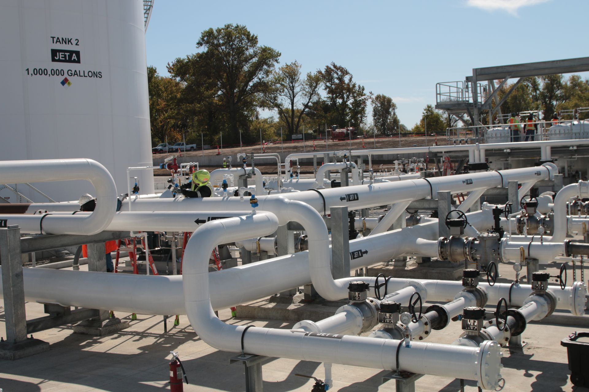 A bunch of white pipes are lined up in a row