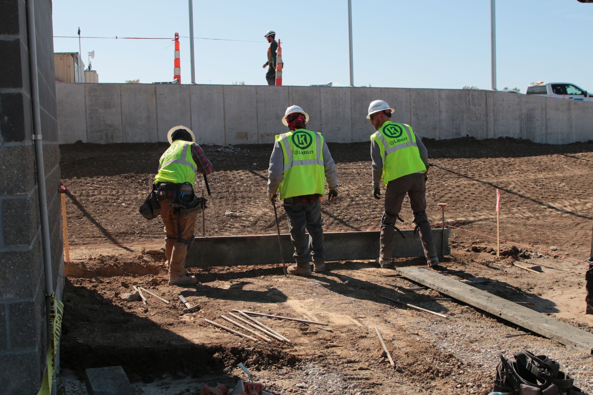 A group of construction workers are working on a construction site.