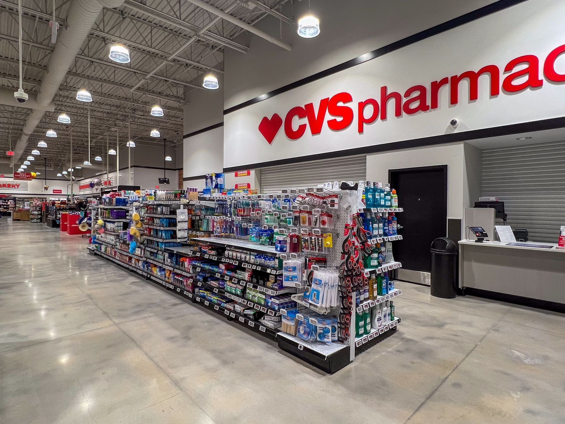 A cvs pharmacy with a lot of shelves and a counter