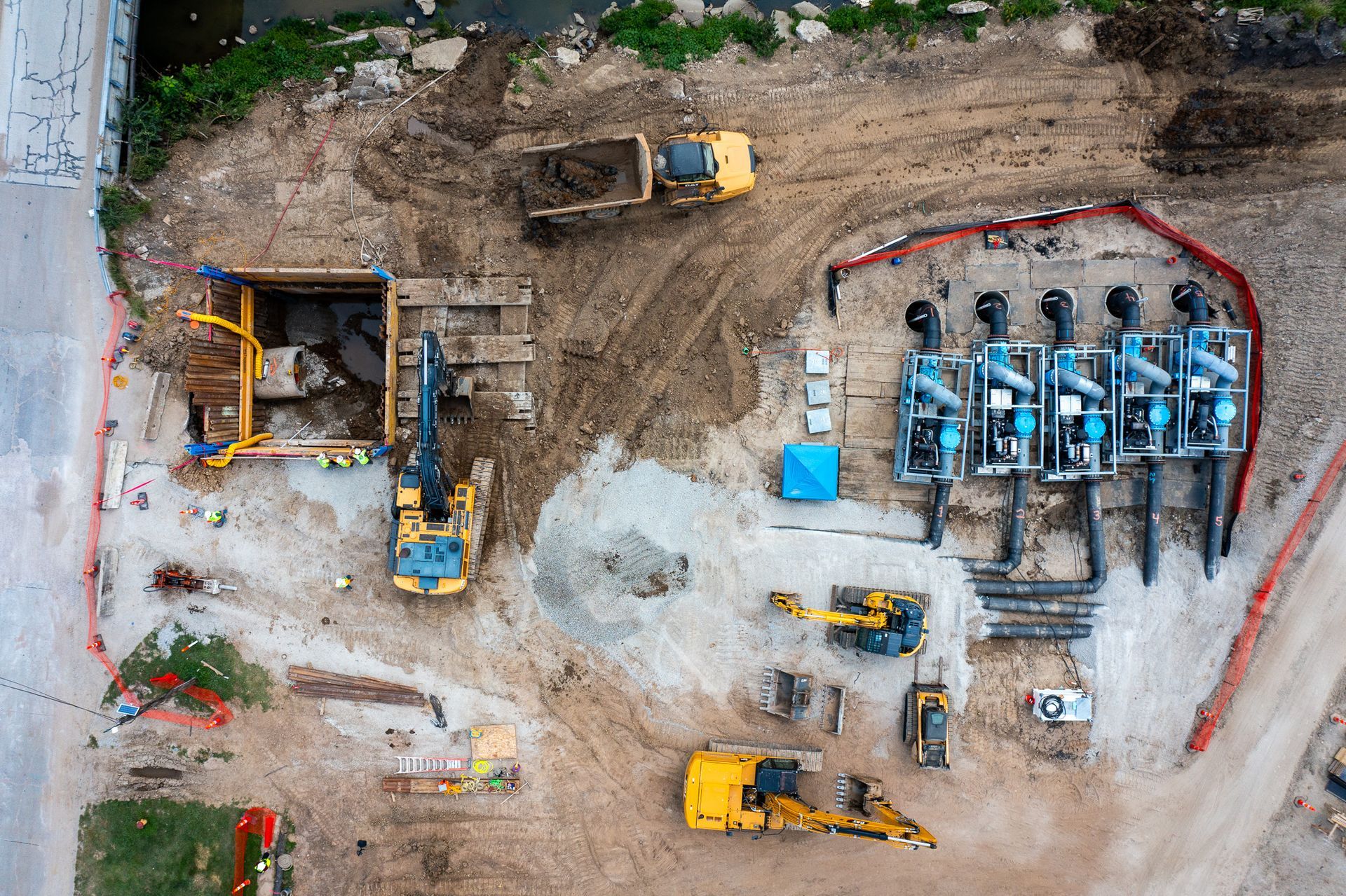 An aerial view of a construction site with a lot of machinery.