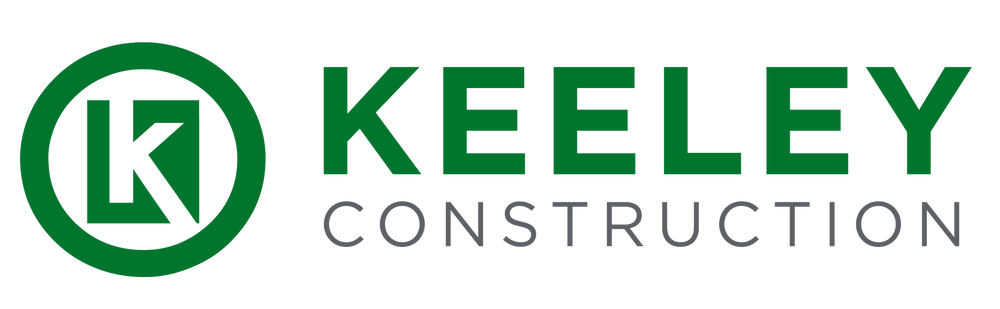 The logo for keely construction is green and white.