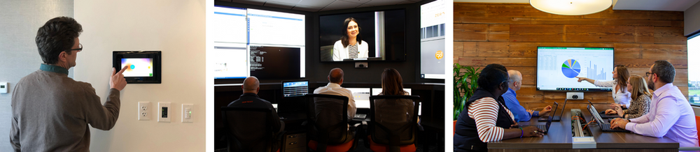 A man is using a tablet while a group of people are sitting in a conference room.