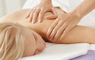 Chiropractic Clinic — Woman Receiving Massage in Casper, WY
