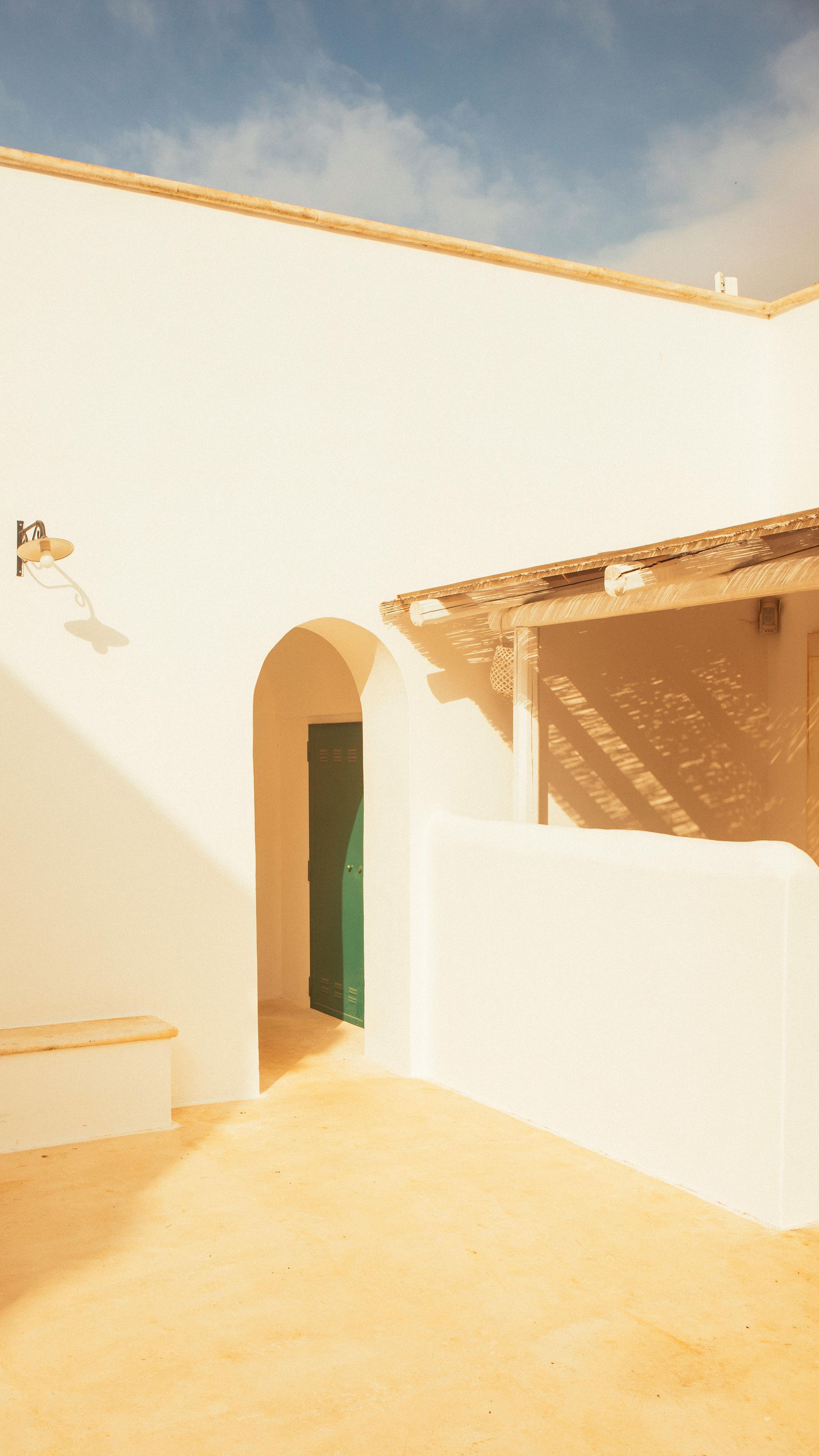 A man is leveling a concrete floor with a level.