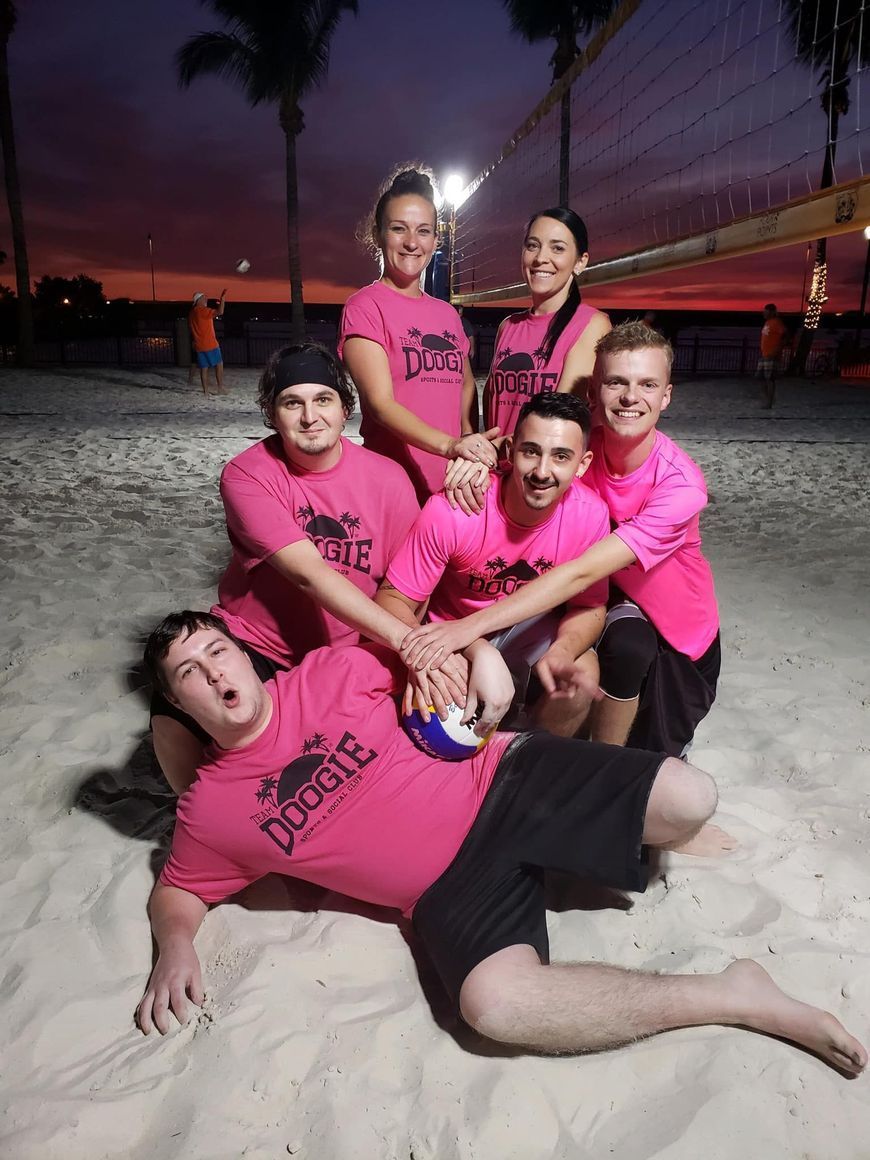 A group of people wearing pink shirts with the word doubts on them