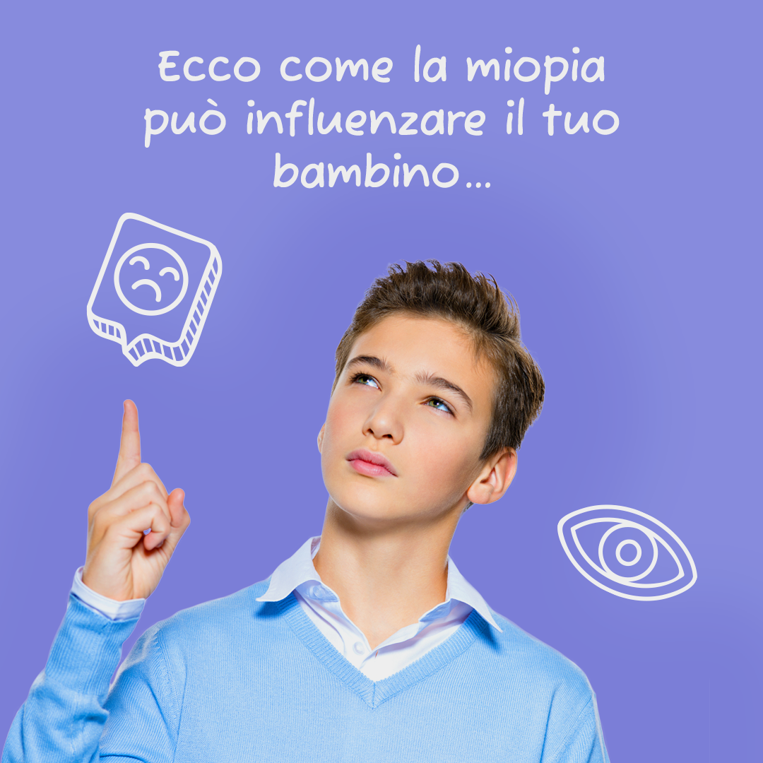 Un ragazzo con un maglione blu indica qualcosa