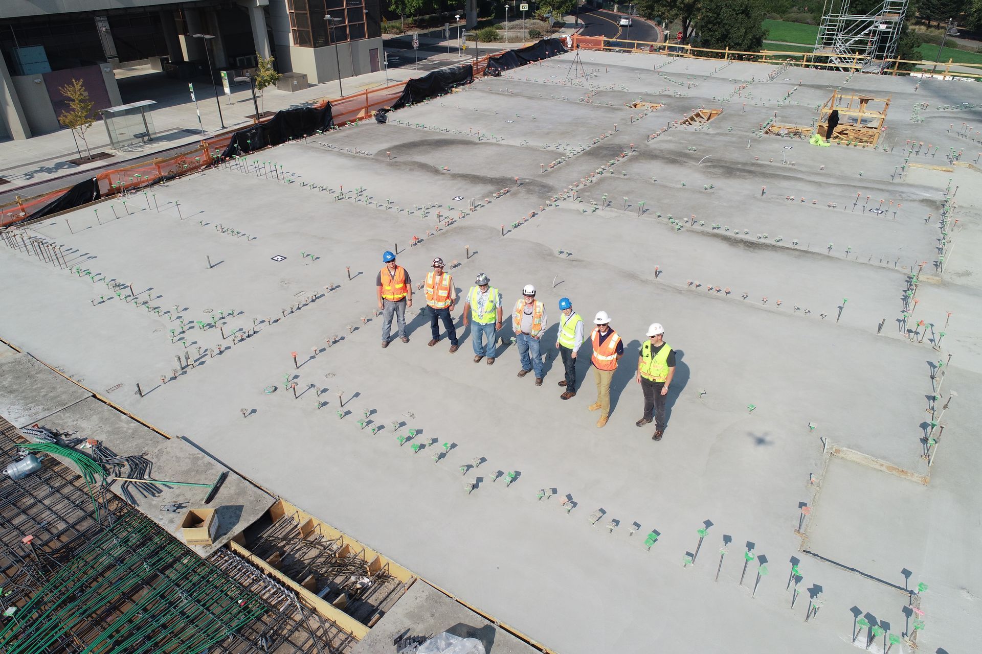 Men standing at a concrete project that had just been cored