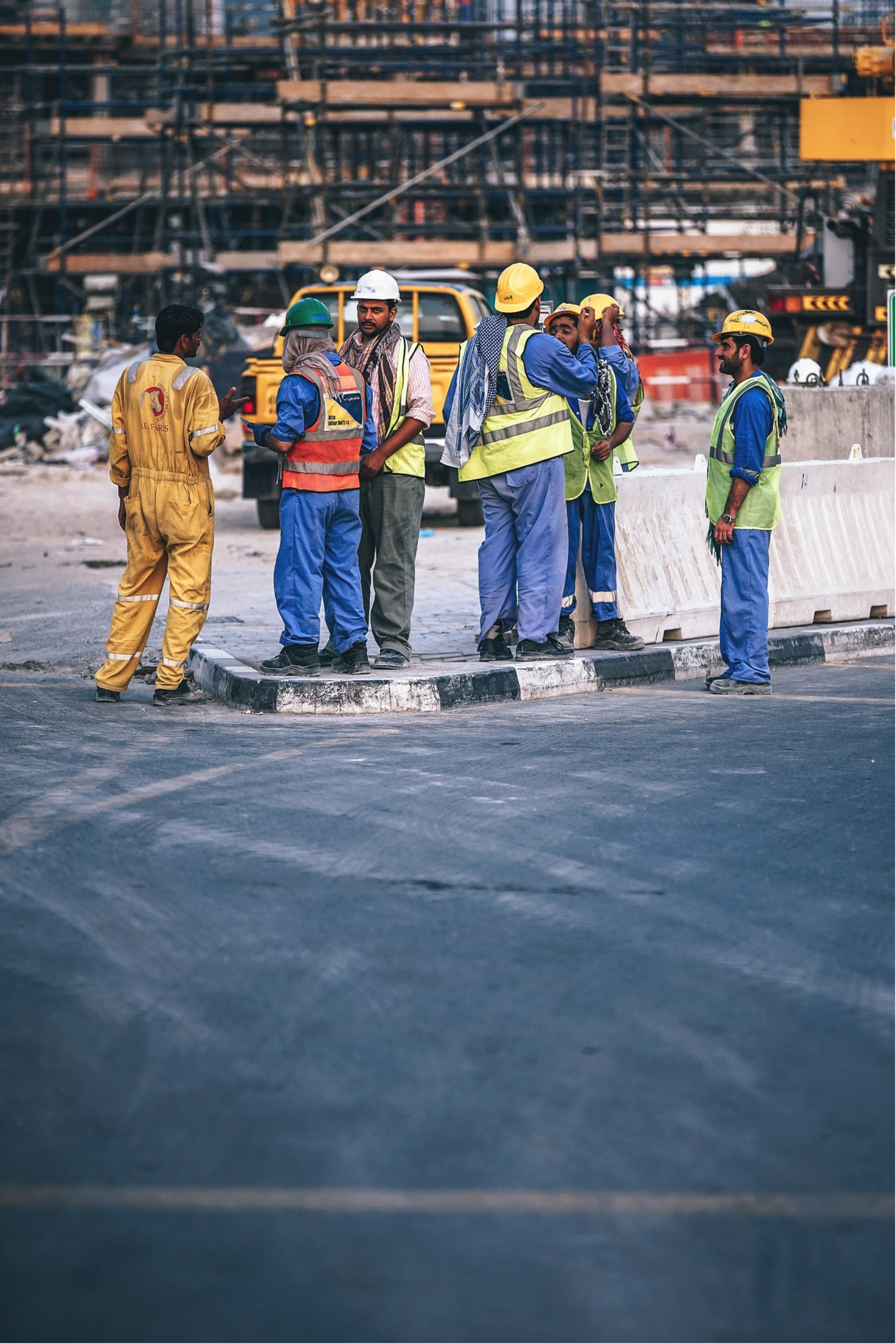 a team of concrete workers installing concrete for a project involving curbing