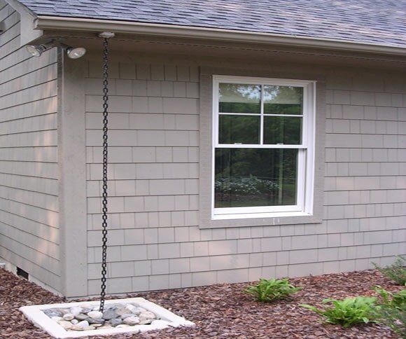 River Rock in Gutter Drain — Landscaping Stone in Denton, NC