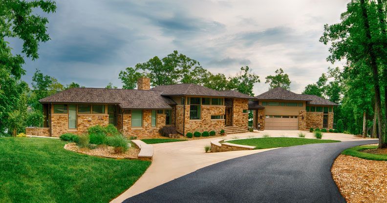 A large house with a driveway leading to it