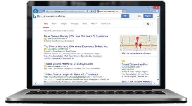 A laptop computer is open to a google search page.