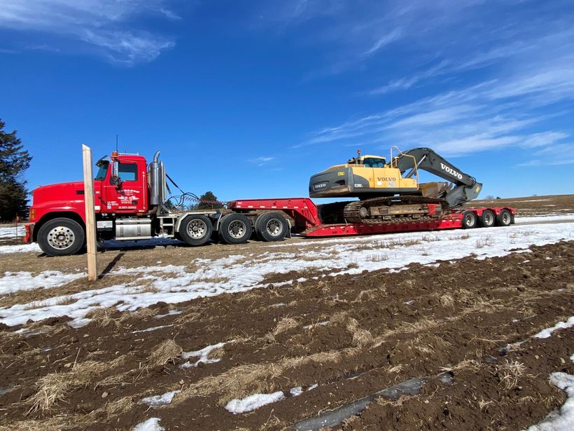 Red truck clearing the road — Peshtigo, WI — Carlson Forestry Mulching & Earthworks