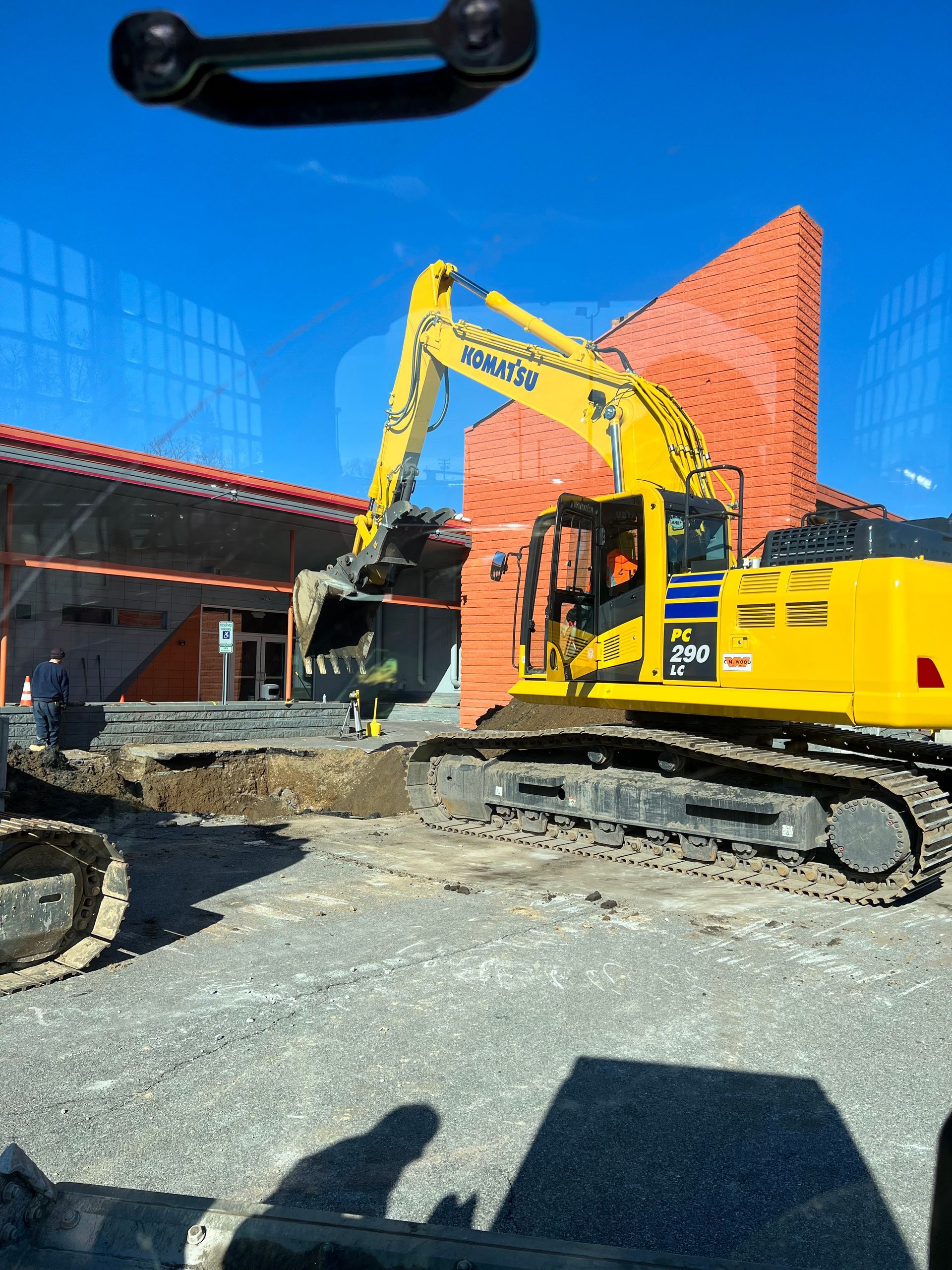 A large yellow excavator with komatsu written on it