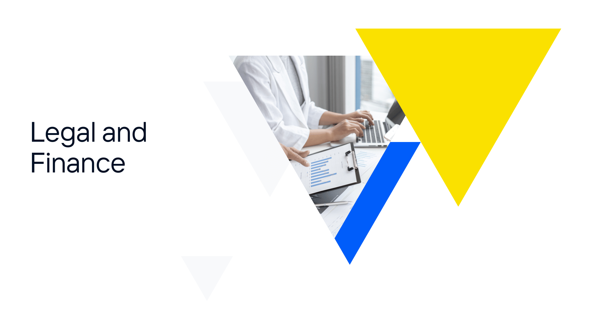 A group of people are sitting at a table with a laptop and a clipboard.