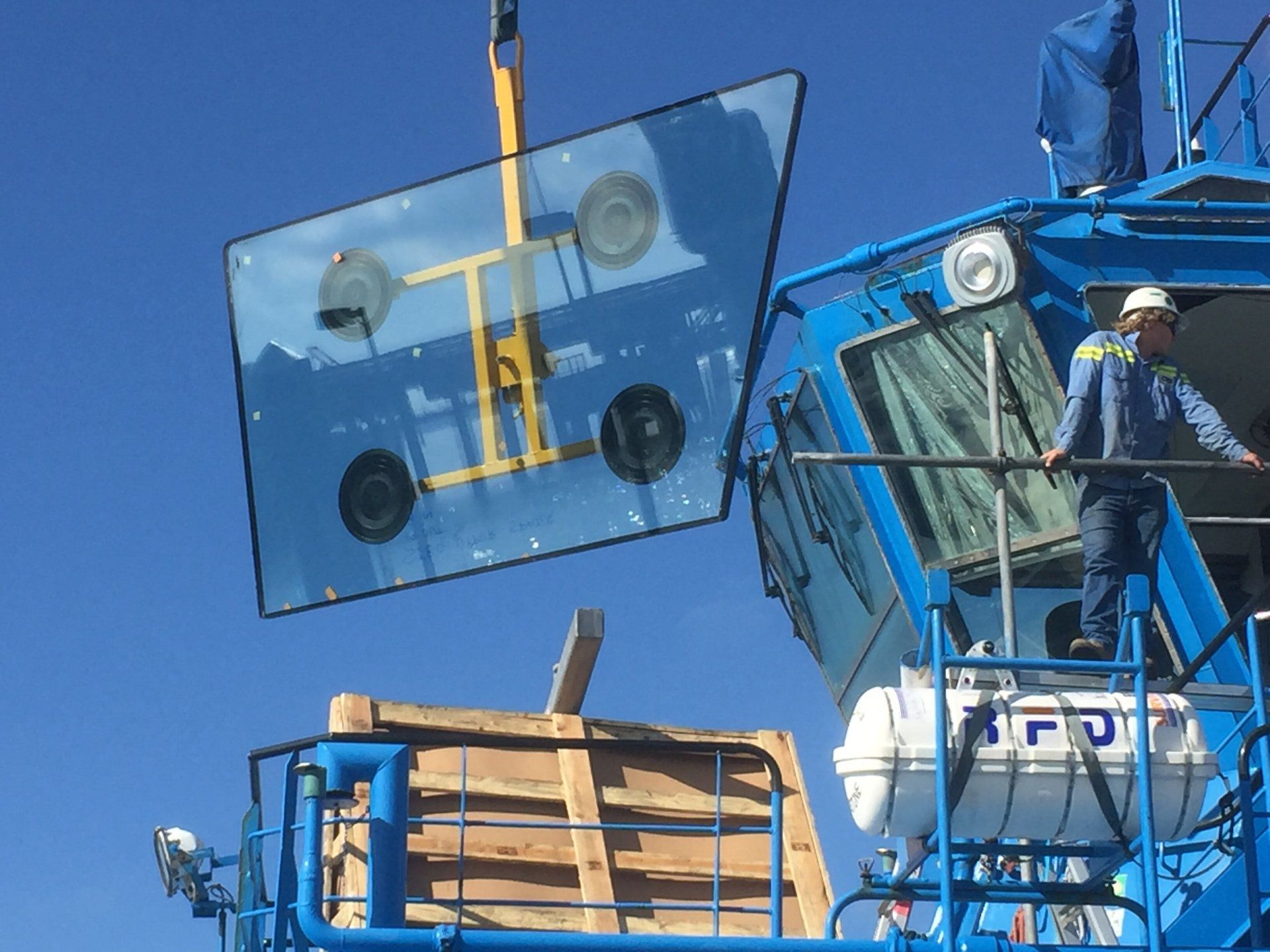 Crane moving panel of glass