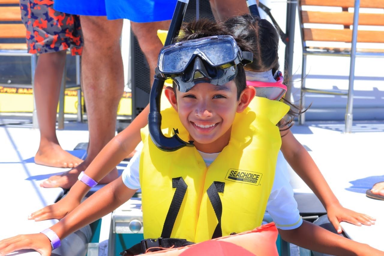 a boy snorkeling in cabo on baja blast