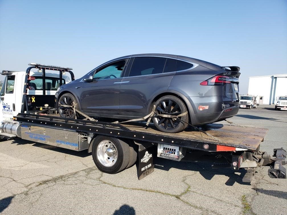 Truck Carrying a Gray Car — Concord, CA — ABC Towing