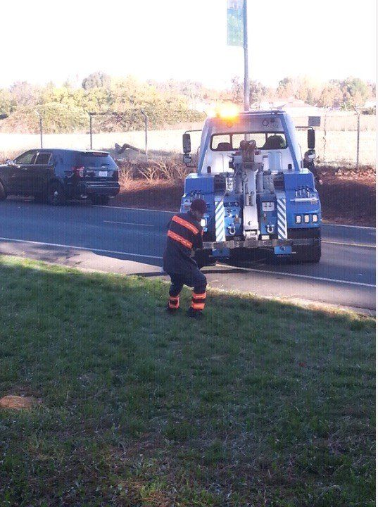 Man Pulling the Hook of the Tow Truck — Concord, CA — ABC Towing