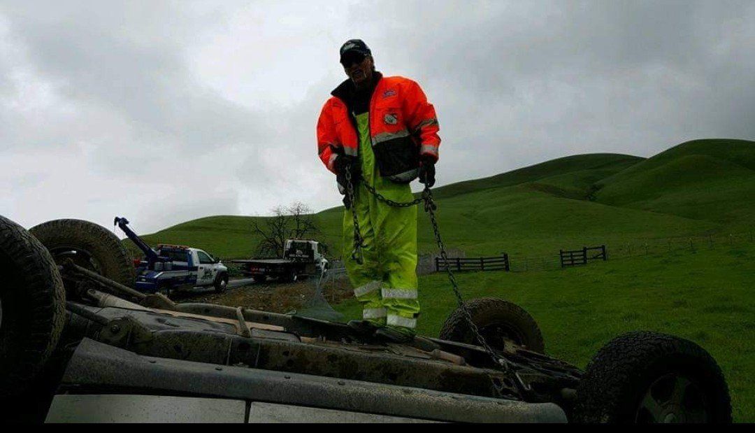 Man Standing on a Flipped Car — Concord, CA — ABC Towing