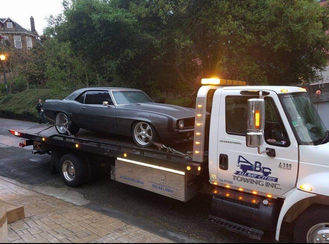 Truck Carrying a Gray Car — Concord, CA — ABC Towing