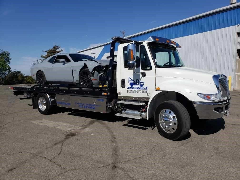 Truck Carrying a Damaged Car — Concord, CA — ABC Towing