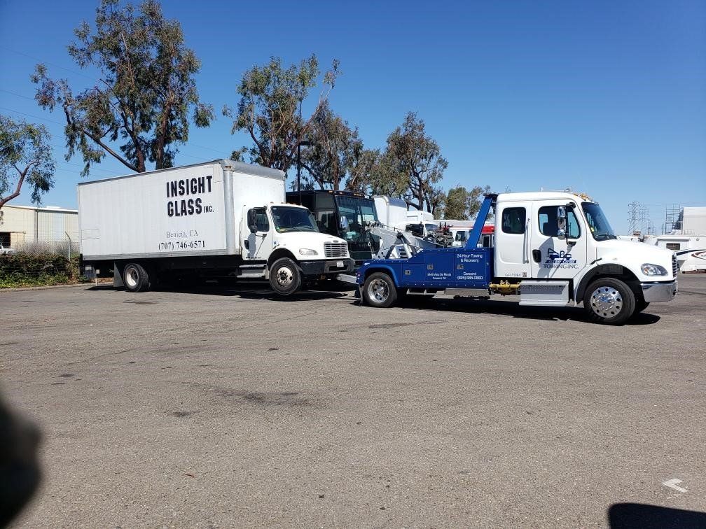 Truck Towing a White Truck — Concord, CA — ABC Towing