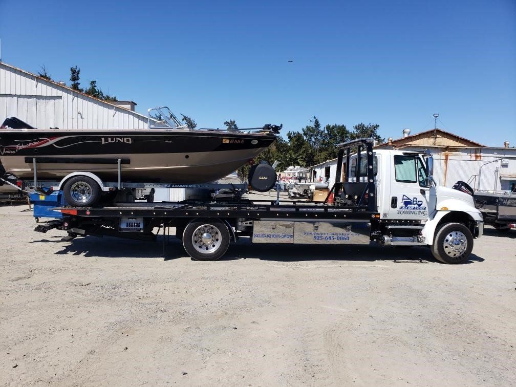 Truck Carrying a Boat — Concord, CA — ABC Towing