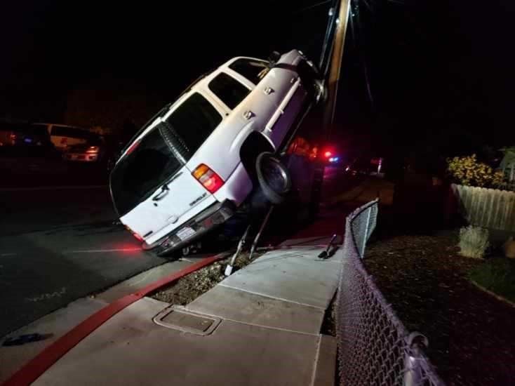 White Car Stuck on a Metal Cable — Concord, CA — ABC Towing