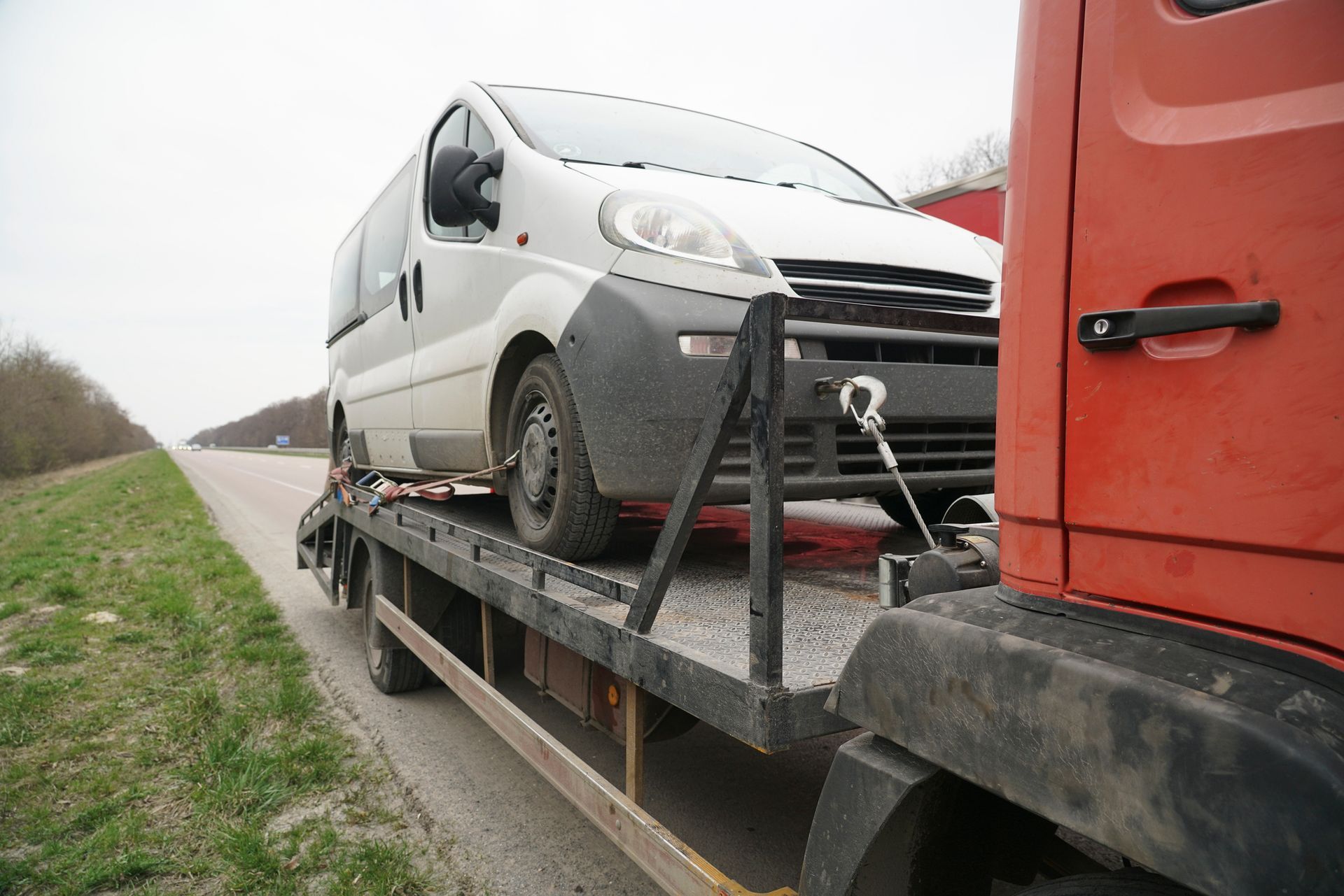 Loading a minibus onto a tow truck.