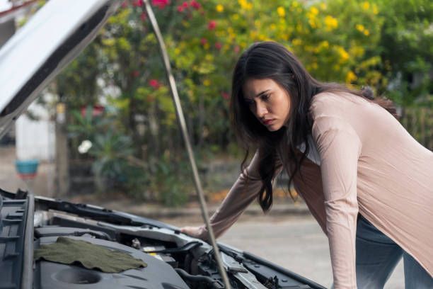 Young woman stress while waiting insurance or roadside assistance service.